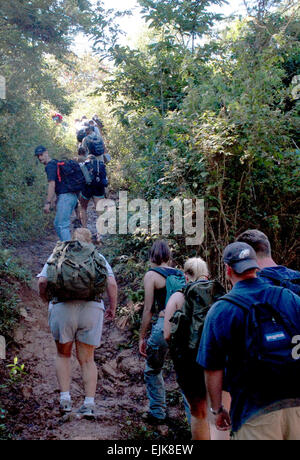 LA SAMPEDRANA, Honduras - Airman, Soldiers and Sailors from Joint Task Force-Bravo at Soto Cano Air Base, Honduras, traverse a steep trail to deliver food to a local village here. The servicemembers completed a five and a half mile hike up the mountain here to deliver more than 600 pounds of food to local villagers Nov. 17.  This hike is the third in a series of five sponsored by the JTF-Bravo Chapel. U.S. Air Force photo/Tech. Sgt. Sonny Cohrs Stock Photo