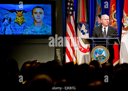 Defense Secretary Robert M. Gates addresses the audience during a Medal of Honor ceremony for US Army Staff Sgt. Robert J. Miller at the Pentagon, Oct. 7, 2010.  Miller was posthumously awarded the nation's highest honor for his heroic actions in Afghanistan on January 25, 2008, after displaying immeasurable courage and uncommon valor eventually sacrificing his own life to save the lives of his teammates and 15 Afghanistan National Army soldiers.  Defense Department photo by Cherie Cullen.  Visit /medalofhonor/miller/  /medalofhonor/miller/   to learn more about SSG Miller and to view the “bat Stock Photo