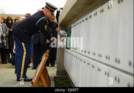 Staff Sgt. Michael Drake, infantryman, Delta Company, 3d U.S. Infantry Regiment The Old Guard, places the remains of Civil War veteran, Pvt. Lycurgus McCormack, inside of the new Columbarium Court No. 9 in Arlington National Cemetery, Va., May 9, 2013 A joint full honors committal service for six unclaimed remains of veterans from all branches of the Armed Forces were the first to be inured at the new site.  Sgt. Jose Torres, Jr. Stock Photo