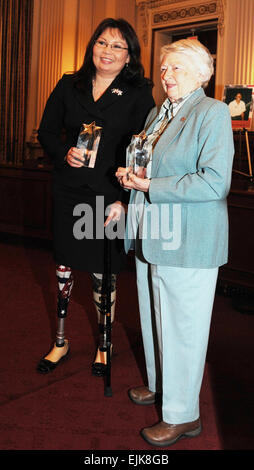 L. Tammy Duckworth, assistant secretary for public and intergovernmental affairs at the Department of Veterans Affairs, left, and retired Air Force Brig. Gen. Wilma Vaught were inducted into the Army Women's Foundation hall of fame March 17, on Capitol Hill, for extraordinary service to the U.S.  Army.          Duckworth, Vaught inducted into Army Women's Foundation hall of fame  /-news/2010/03/18/36038-duckworth-vaught-inducted-into-army-womens-foundation-hall-of-fame/index.html Stock Photo
