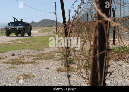 A Humvee from the Puerto Rico Army National Guard's, 480th Military Police Company, patrols the perimeter of the detention facility at Guantanamo Bay Naval Base, Cuba, Oct. 7. A decision as to whether the detention facility will close in January will most likely be made over the next month, U.S. Attorney General Eric Holder said Thursday night on National Public Radio's &quot;All Things Considered.&quot; Closing it by Jan. 22 would be &quot;difficult&quot; he said, &quot;but not impossible.&quot; Stock Photo