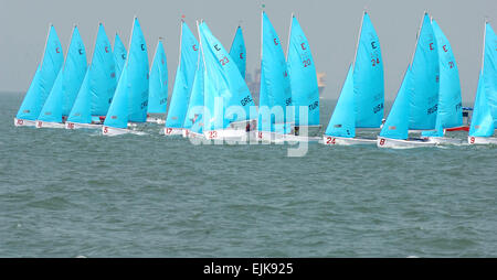 The U.S. armed forces sailing team and 24 other international teams line up for the start of the first of three heats on the second day of the World Military Games sailing competition at the Indian Water Training Center and Yatch Club on Western Naval Command Base in Mumbai, India, Oct. 17, 2007.  The Counceil Internationale du Sport Militarie's Military World Games is the largest international military Olympic-style event in the world.  Staff Sgt. Brian D. Lehnhardt Stock Photo