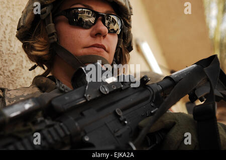 U.S. Army Spc. Rebecca Buck, a medic from Headquarters and Headquarters Company, 1st Battalion, 14th Infantry Regiment, 2nd Stryker Brigade Combat Team, 25th Infantry Division, provides perimeter security outside an Iraqi police station in the Tarmiya Province of Iraq, March 30, 2008.   Tech. Sgt. William Greer Stock Photo