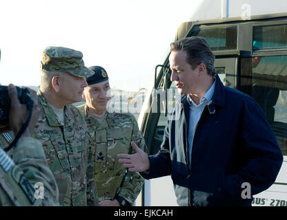 U.S. Army Gen. John F. Campbell, commander,  International Security Assistance Force and U.S. Forces-Afghanistan, speaks with United Kingdom Prime Minister David Cameron during an initial meet and greet upon Prime Minister Cameron’s arrival in Kabul, Oct. 3.   Prime Minister Cameron made an unannounced visit to Kabul to meet with Afghan President Ashraf Ghani and the new unity government four days after Afghan President Ghani was sworn into office.  photo by U.S. Army Staff Sgt. Richard D. Sherba, COMISAF photographer Stock Photo