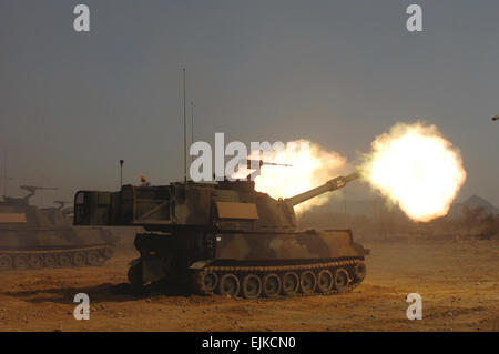 Paladin Howitzer  Pfc Leigh Armstrong, 2ID Public Affairs Office April 05, 2007  Soldiers from Bravo Battery 2-5 Field Artillery fire 155 mm Paladin Howitzers at St. Barbara training area in South Korea as part of the Reception, Staging, Onward Movement, and Integration exercise. The Soldiers traveled from Fort Sill, Okla. to familiarize themselves with terrain and train for relief procedures in conjunction with 1-15 Field Artillery stationed in Camp Hovey. Stock Photo