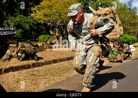 U.S. Army Sgt. 1st Class Chris Richey observes Malawi Defense Force medics during a field training exercise testing their combat lifesaver skills as part of MEDFLAG in Lilongwe, Malawi, May 12, 2011. Richey is a medic assigned to the Army Reserve’s 399th Combat Support Hospital.  Sgt. Jesse Houk Stock Photo