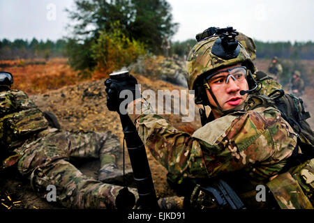 U.S. Army Rangers, 1st Battalion, 75th Ranger Regiment, participate in a Combined Arms Live Fire Exercise CALFX near Fort Stewart, Ga., Jan. 11, 2012. The exercise is conducted in order to evaluate and train members on de-escalation of force, reactions to enemy contact, and other objectives that prepare them for forward operating.  Senior Airman Samuel Goodman Stock Photo