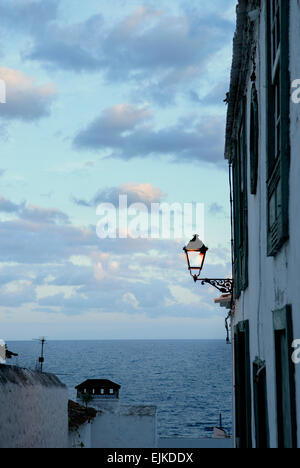 Facade detail with lantern, sea and clouds in the twilight, La Palma island, Spain, Europe - Image taken from public ground Stock Photo