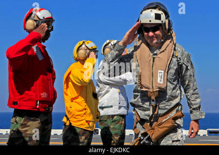 U.S. Army Lt. Gen. P.K. &quot;Ken&quot; Keen, commander of Joint Task Force Haiti, salutes USS Bataan sailors in rainbow sideboy formation after landing on board, Jan. 25, 2010. The Bataan crew has been participating in Haiti earthquake relief efforts.  Lance Cpl. Christopher Carroll  Additional articles and resources regarding Haiti and the Army's involvement  /-news/2010/01/14/32919-haiti-earthquake-relief-mission/index.html Stock Photo