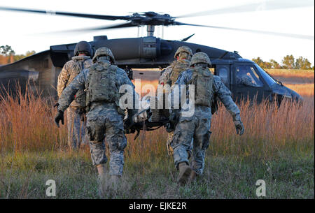 Soldiers from Headquarters and Headquarters Company and Alpha Company, 1-125 Infantry Regiment, 37th Infantry Brigade Combat Team, practice medical evacuation during training at Camp Shelby Joint Forces Training Center, Miss., Nov. 11, 2011. The 37th IBCT is deploying to Afghanistan in support of Operation Enduring Freedom. 37th IBCT photo by Sgt. Kimberly Lamb Released Stock Photo