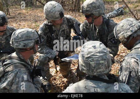 2nd Lt. Jake Bunch, platoon leader of 2nd Battalion, 9th Infantry Regiment, 1st Armored Brigade Combat Team, 2nd Infantry Division, briefs his platoon on the plan during a platoon live fire exercise Feb. 15, 2013, at the annual exercise Cobra Gold in Dan Ban Lan Hoi, Kingdom of Thailand.  Capt. Lindsey Elder, 1st ABCT PAO Stock Photo