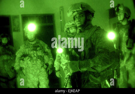 U.S. Army Pfc. Frank Calderon and other members of his team search a home of suspected terrorists near Mosul, Iraq, March 10, 2007.  The Soldiers are from Delta Company, 2nd Battalion, 7th Cavalry Regiment, 4th Brigade Combat Team, 1st Cavalry Division, from Fort Bliss, Texas.  Senior Airman Vanessa Valentine Stock Photo