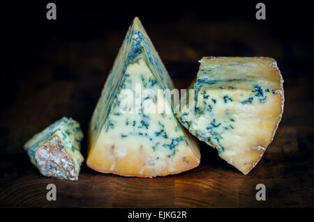 Stilton mature blue mouldy cheese - Dark background Stock Photo