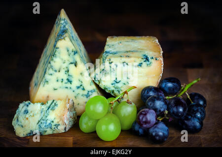 Stilton mature blue mouldy cheese - Dark background Stock Photo