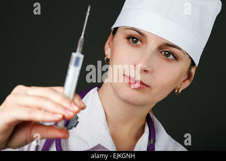 woman doctor with syringe in hand Stock Photo