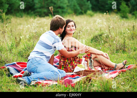 Happy young couple spending time together in park Stock Photo