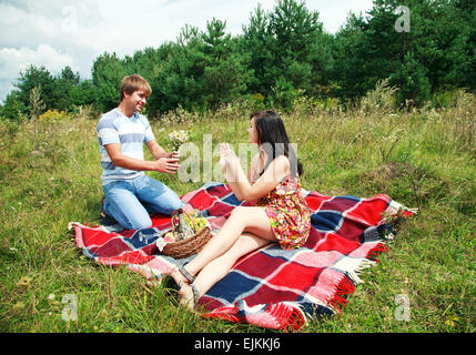 Happy young couple spending time together in park Stock Photo