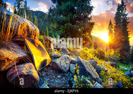 Arrow sign pointing to the sunset in the mountains of Kazakhstan Stock Photo