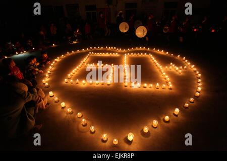 Beijing, China's Hebei Province. 28th Mar, 2015. People form the shape of '60' with candles during the annual Earth Hour campaign at Tangjiazhuang Village in Xingtai, a city in north China's Hebei Province, March 28, 2015. © Zhu Xudong/Xinhua/Alamy Live News Stock Photo