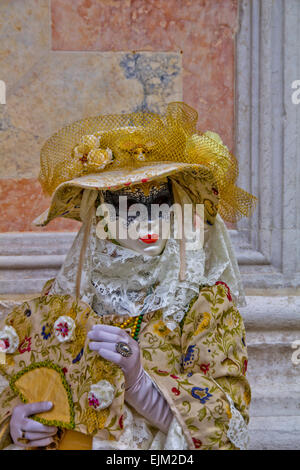 VENICE, ITALY - FEBRUARY 9, 2013: Unidentified person with Venetian carnival mask in Venice, Italy. At 2013 it is held from Janu Stock Photo
