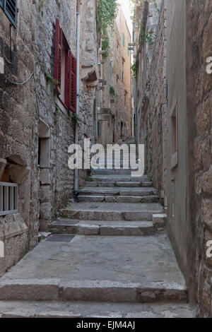 Steps and alleyway between medieval stone houses leading up to the Cathedral Square, Korcula Croatia