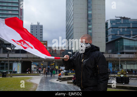 Manchester, UK 28th March, 2015. Combined National Front and White Pride Demo in Piccadilly.  Arrest made as Far Right 'White Pride' group gathered in Manchester to stage a demonstration. Around 50 members of the group waved flags and marched through Piccadilly Gardens. With anti-fascist campaigners staging a counter-demonstration police line separating the two sides. Greater Manchester Police said two arrests were made, one for a breach of the peace. The second was also held over a public order offence. Credit:  Mar Photographics/Alamy Live News Stock Photo