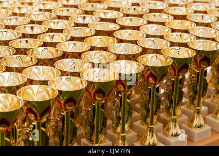 Group of small gilded plastic trophies Stock Photo