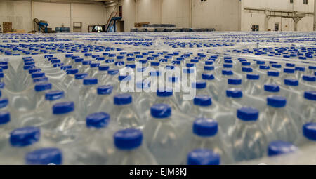 Thousands of water bottles are stored in warehouse Stock Photo