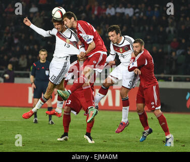 Georgia's Lasha Dvali (2nd left) and Guram Kashia and Germany's Thomas Mueller (l) and Mats Hummels (2nd right) vie for the ball during their soccer UEFA EURO 2016 qualifying group D match Georgia vs. Germany at Boris-Paitschadse-Stadium in Tbilisi, Georgia, on 29 March 2015. Photo: Arne Dedert/dpa Stock Photo