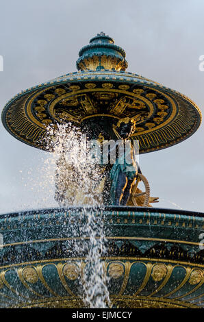 An August sunset lights the Fontaine des Fleuves in the Place de la Concorde, Paris, France. Stock Photo