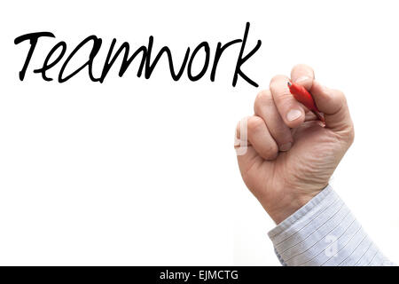 A Photo / Illustration of a Hand Writing 'Teamwork' Stock Photo