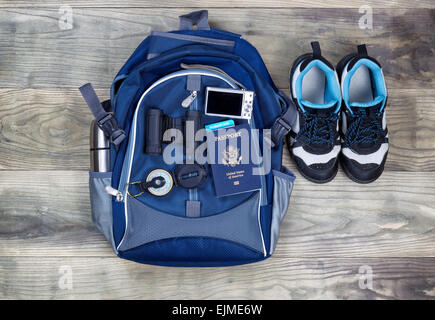 Top view shot of travel gear on aged wooden boards Stock Photo