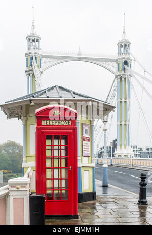Albert Bridge, red phone booth, London Stock Photo