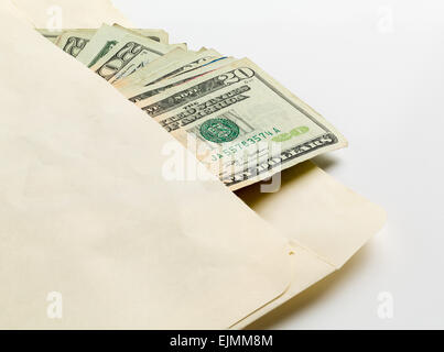 Stack of used $20 US currency bills or notes in an envelope in a concept photo for a bribe or payment Stock Photo