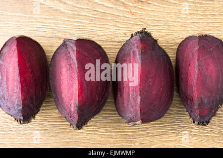 Slices of roasted beet on a wooden table top view Stock Photo