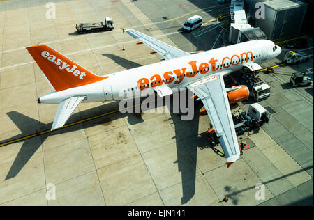 Easyjet aeroplane being serviced on the apron at Gatwick airport, north terminal, West Sussex, England. Stock Photo