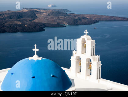 Greek Orthodox church  blue dome and bells, Firostefani, Santorini (Thera), Greece. Stock Photo