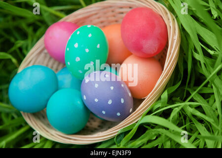 Colorful Easter eggs in a basket Stock Photo