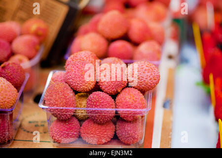 Fresh lychees on sale at the fruit market Stock Photo