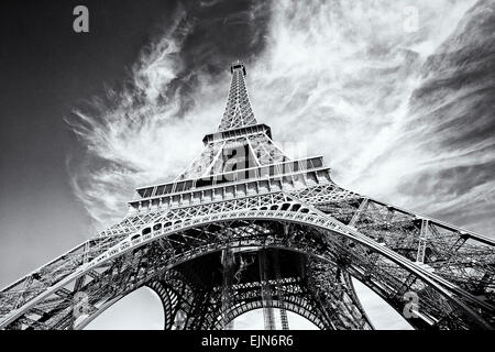 Dramatic view of Eiffel Tower in Paris, France. Black and white image, same film grain added. Stock Photo