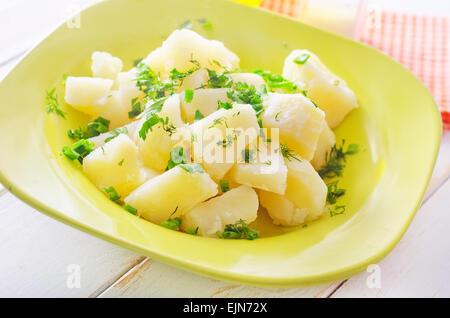 boiled potato with greens in the green plate Stock Photo