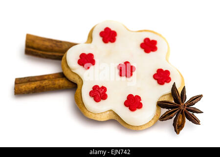 Gingerbread cookies with royal icing in the shape of a flower with star anise and cinnamon Stock Photo