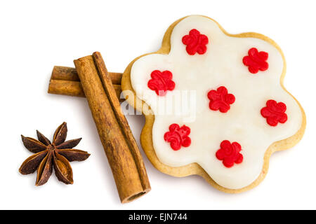 Gingerbread cookies with royal icing in the shape of a flower with star anise and cinnamon Stock Photo