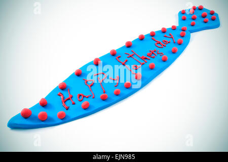 a tie made with blue modeling clay with the sentence happy fathers day written in red, on a white background Stock Photo