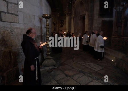Franciscan priests taking part in a Roman Catholic mass procession inside the Church of Holy Sepulchre in the Christian Quarter old city East Jerusalem Israel Stock Photo