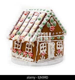 Traditional home made Ginger bread house isolated on a white studio background. Stock Photo