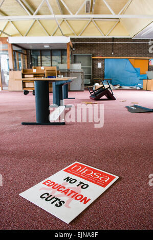 NIPSA 'No To Education Cuts' protest banner in an abandoned school library Stock Photo