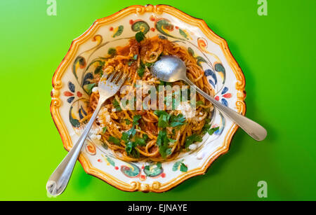 Spaghetti with sardines and olives in ornate Italian bowl, a Sicilian classic recipe Stock Photo