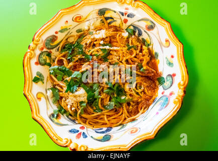 Spaghetti with sardines in ornate Italian bowl, a Sicilian recipe Stock Photo