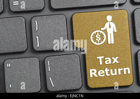 Brown tax return key on keyboard Stock Photo